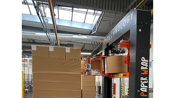 a paper wrapping machine being used at a Mondi factory